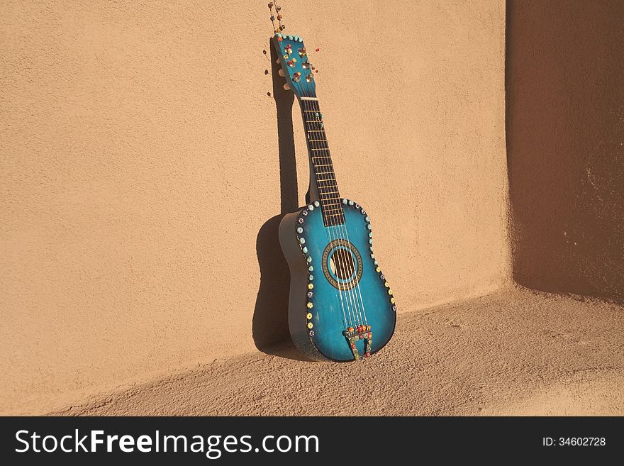 A decorated blue mandolin. A decorated blue mandolin.