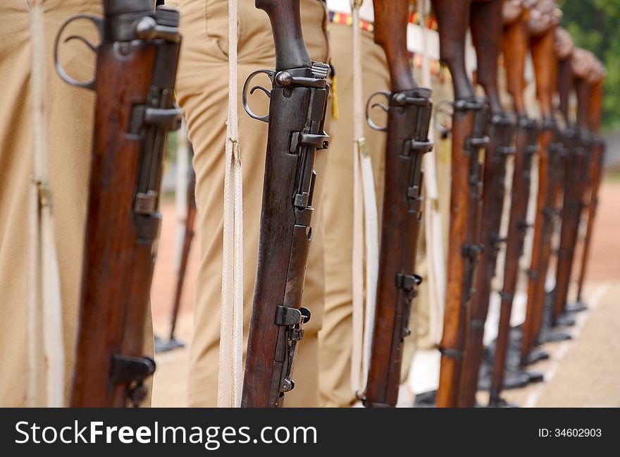 Soldiers. shallow depth of field. Focus on the first hand and bayonet. Soldiers. shallow depth of field. Focus on the first hand and bayonet