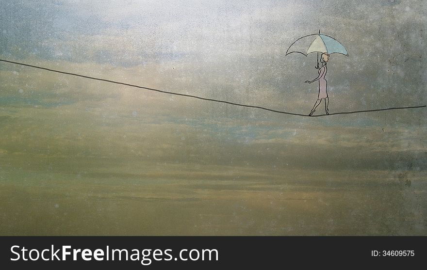 Woman with umbrella walking on a tightrope. Woman with umbrella walking on a tightrope