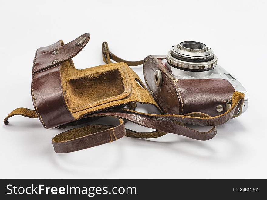 Retro camera isolated on white background in leather pack. Retro camera isolated on white background in leather pack.