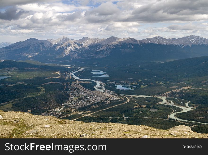 Ariel view of the town of Jasper and the surrounding area including the mountain range in the background. Ariel view of the town of Jasper and the surrounding area including the mountain range in the background