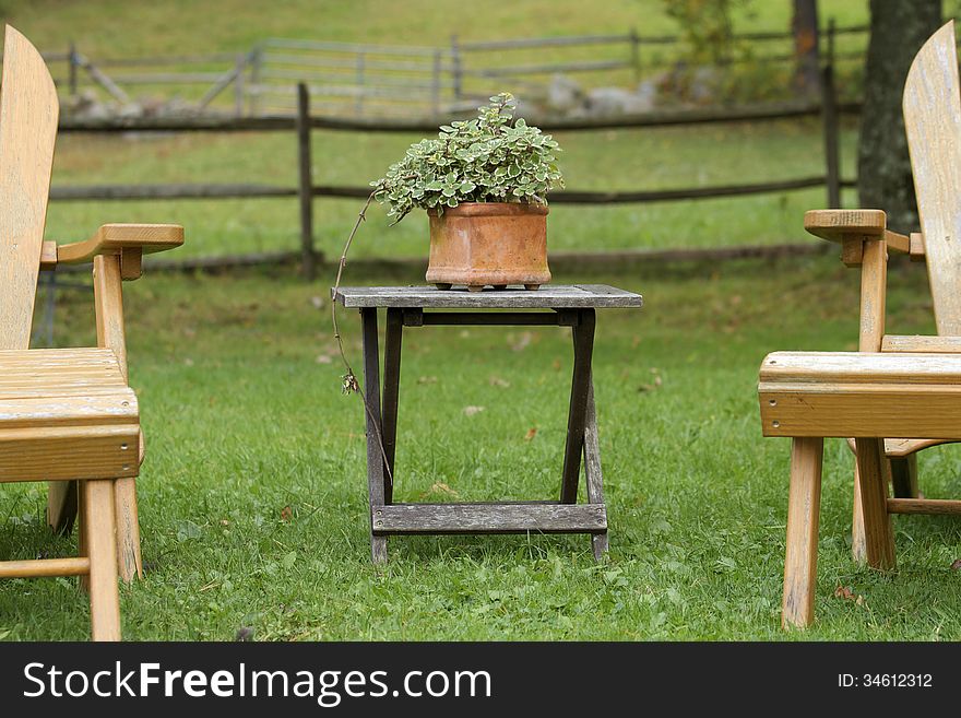 Two chairs in a garden in the country. Two chairs in a garden in the country