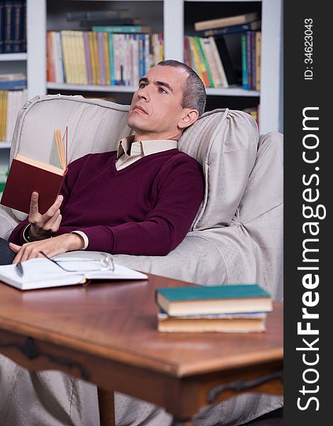 Handsome successful lawyer reading a book. Handsome successful lawyer reading a book