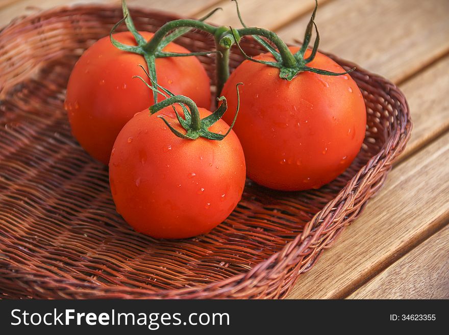 Fresh Red Tomatoes In A Basket