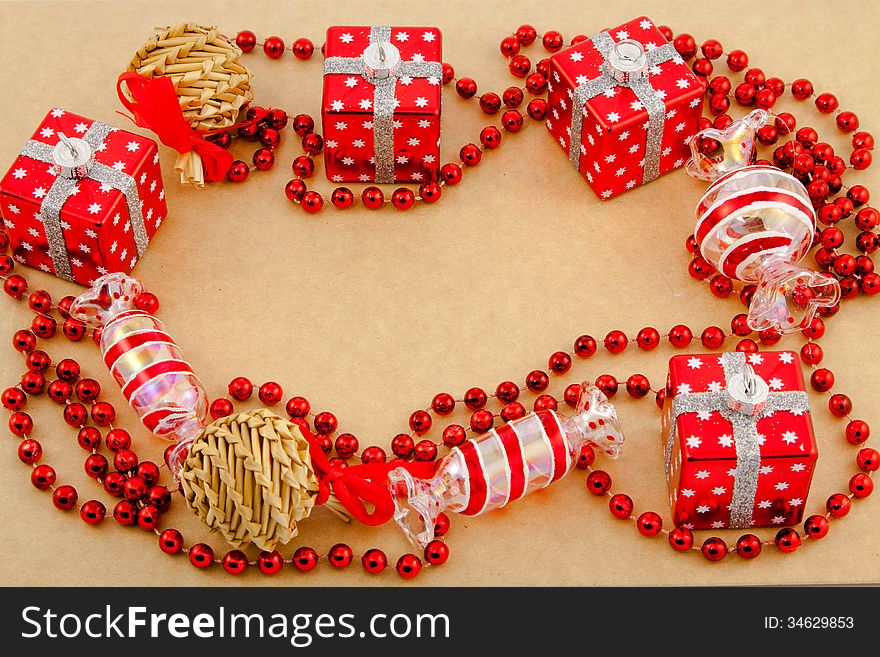 Red Christmas toys on a brown background. Red Christmas toys on a brown background