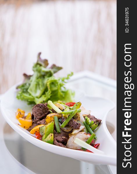 Black pepper spicy stir fried beef with onions. Black pepper spicy stir fried beef with onions