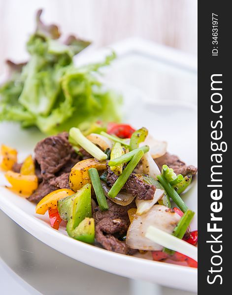 Black pepper spicy stir fried beef with onions. Black pepper spicy stir fried beef with onions