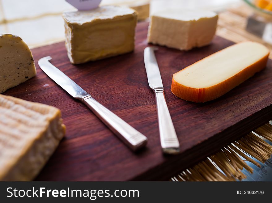 Butter knife with variety of cheese. Butter knife with variety of cheese