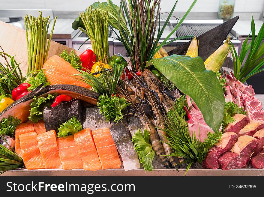 Fresh meat fish vegetables decorated in buffet line restaurant hotel