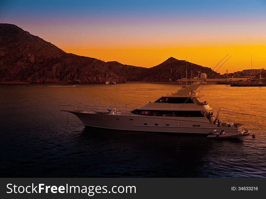 Luxury yacht in the harbor at sunset in Cabo San Lucas, Mexico