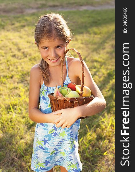 little girl with basket of fresh fruit-happy child