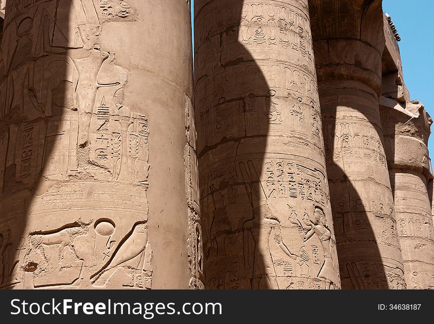 Egyptian hieroglyphs on the columns of Karnak temple in Luxor