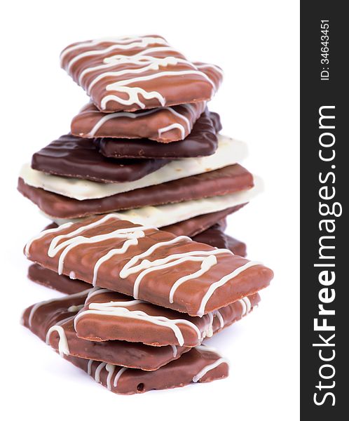 Stack of Chocolate Biscuits with Dark, Milk and White Chocolate Glazed isolated on white background