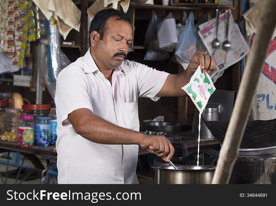 Indian Roadside tea vendor making tea