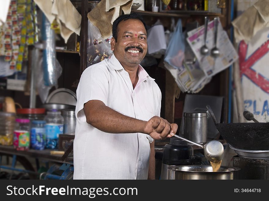 Indian roadside tea vendor making tea