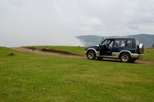 Offroad Car: Driving Into The Mist Stock Images