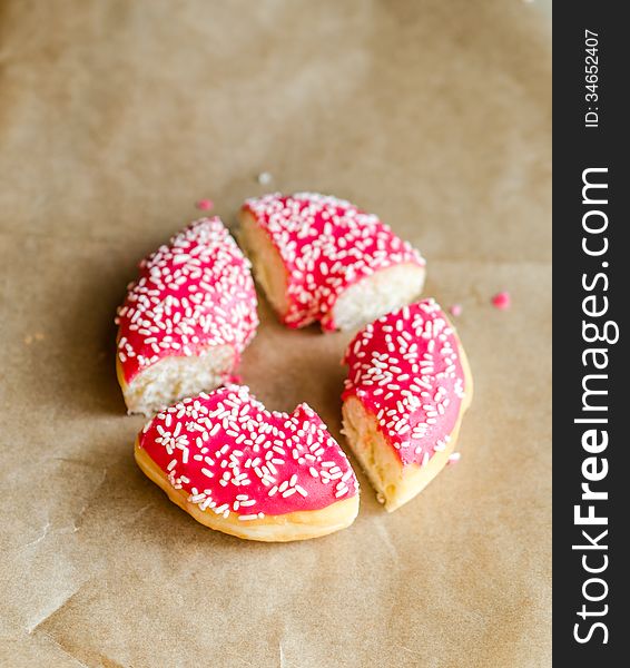 Pink sliced donut close up