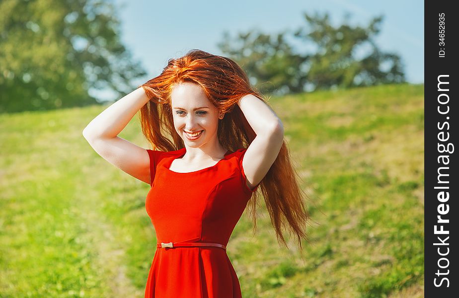 Redhead young woman outdoor in summer. Redhead young woman outdoor in summer