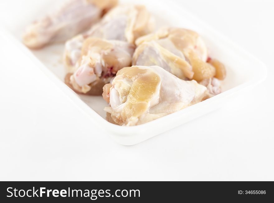 Food fresh chicken in foam isolated on white background. Food fresh chicken in foam isolated on white background