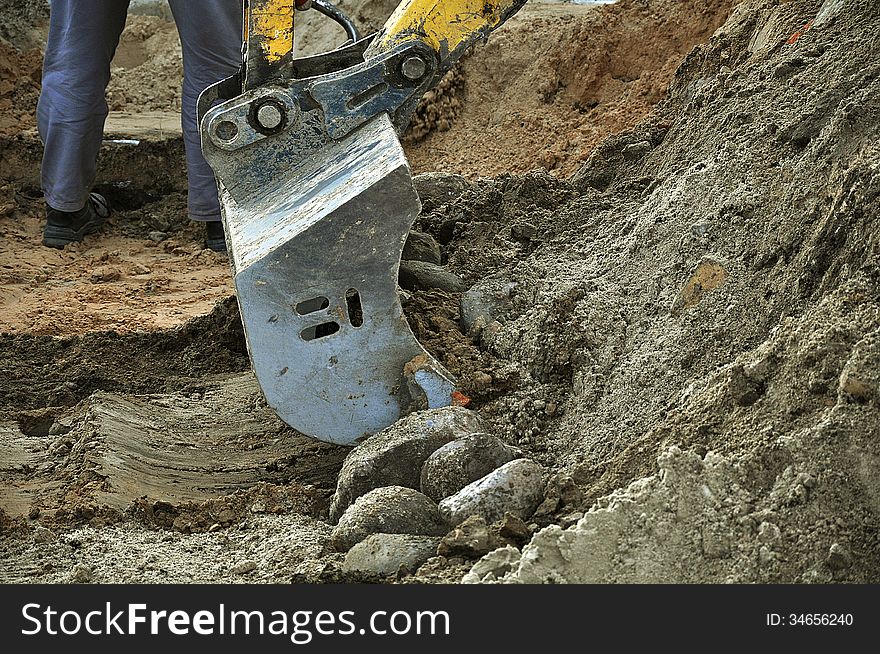 Excavator bucket on a construction site. Excavator bucket on a construction site