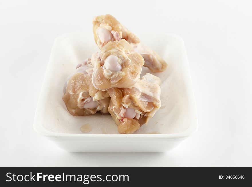 Food fresh chicken in foam isolated on white background. Food fresh chicken in foam isolated on white background