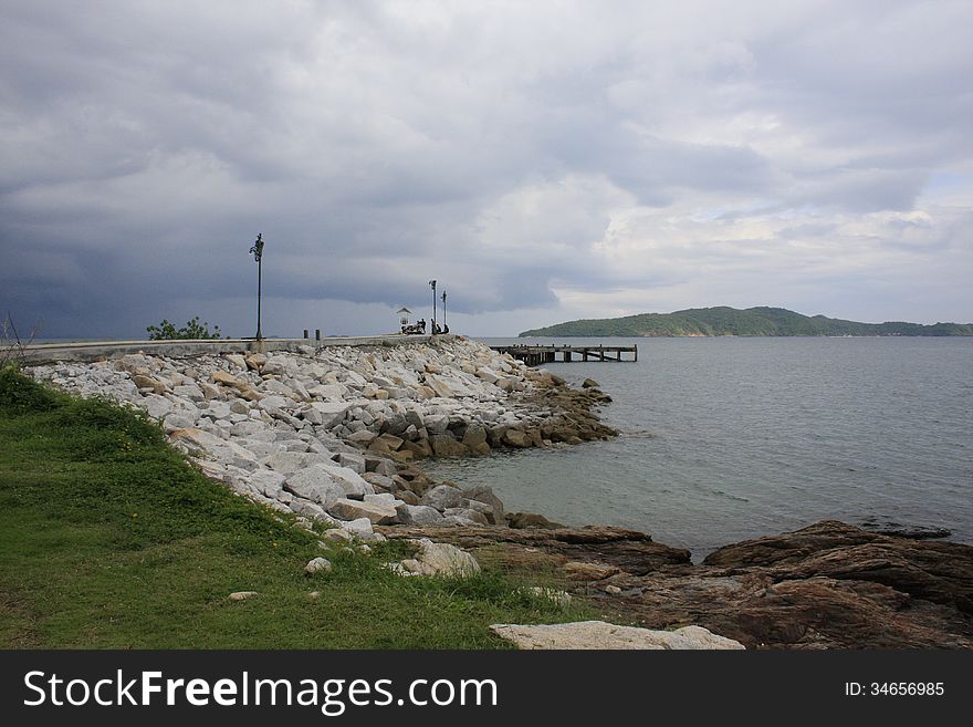 Far view of Walk way to pier at Khao Laem Ya National Park, Phe, Rayong, Thailand with Samed Island in view.