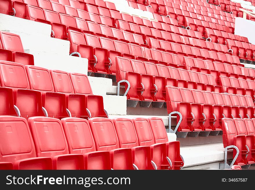 New red and white chairs in the stadium