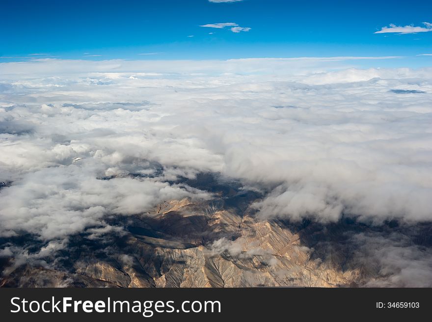 Himalaya mountains under clouds. India