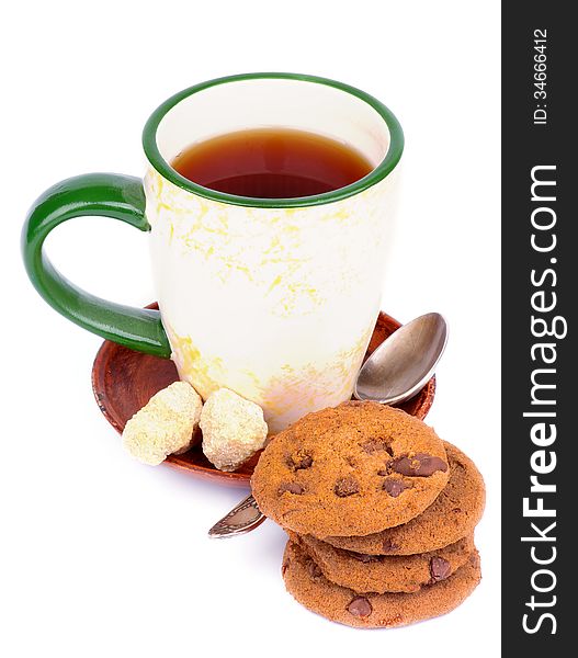 Cup of Tea with Sugar Cubes, Tea Spoon and Chocolate Chip Cookies isolated on white background. Cup of Tea with Sugar Cubes, Tea Spoon and Chocolate Chip Cookies isolated on white background