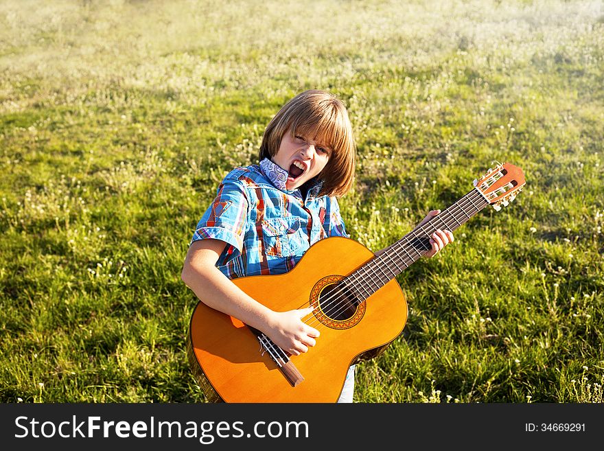 boy playing the guitar- guitarist