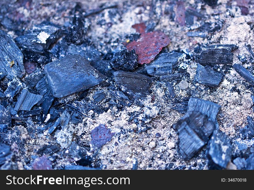 Cooled down black and grey coals from the fire. Cooled down black and grey coals from the fire