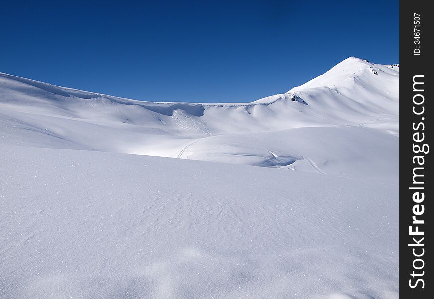 Winter landscape background high in the alps