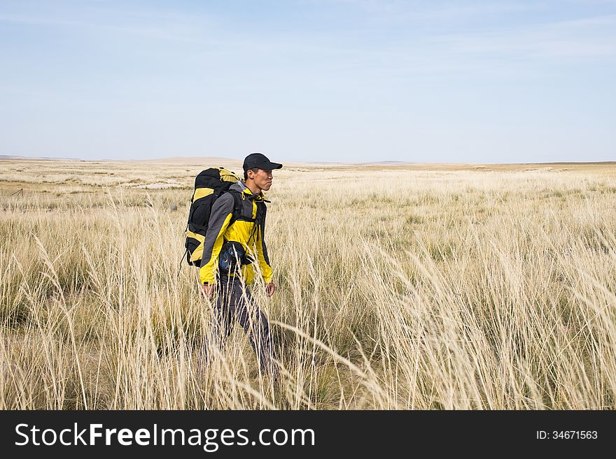 Hikers walking in autumn steep hill. Asian Youth. Hikers walking in autumn steep hill. Asian Youth