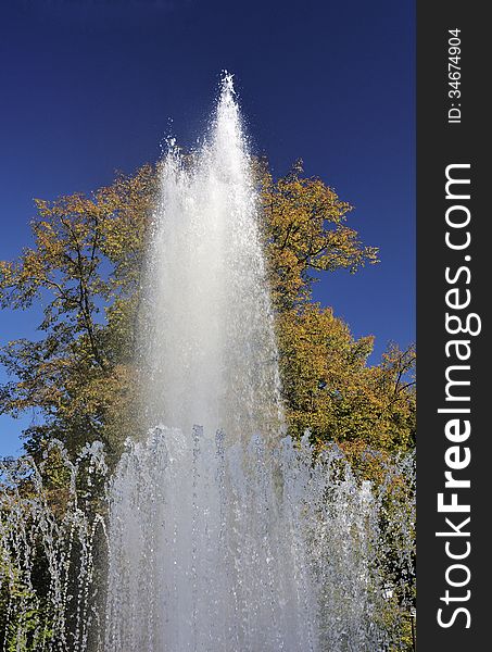 Splashes of fountain water in a sunny day