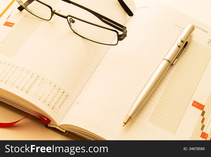 Calendar with glasses and pen. Calendar with glasses and pen