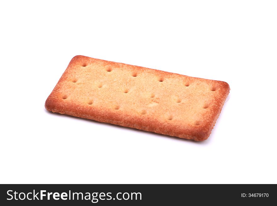 A piece of biscuit over white. A piece of biscuit over white.
