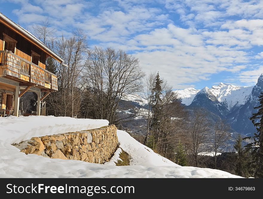 Alpine chalet overlooking the snowy mountain