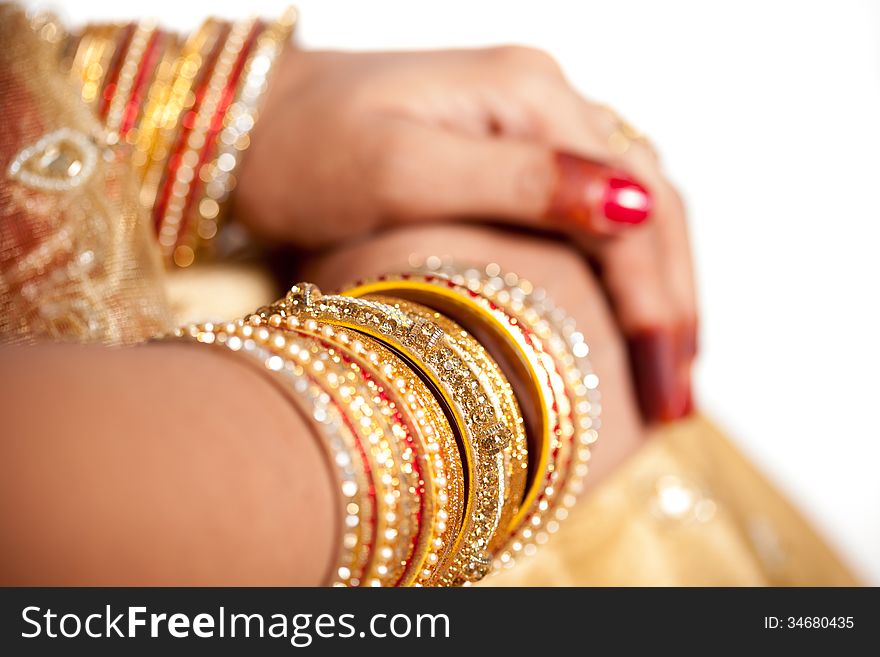 Hand detail of indian bride with decorative bangle and gold ring. Hand detail of indian bride with decorative bangle and gold ring