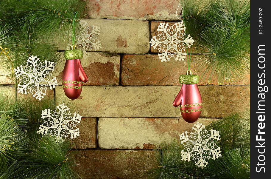 Pair of red mittens on brick wall background. Pair of red mittens on brick wall background