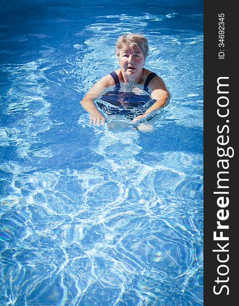 Worried Senior Woman Swimming in the Pool