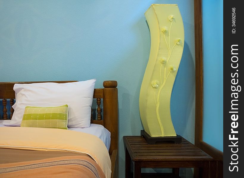 Nicely decorated bedroom in hotel, color coordinated