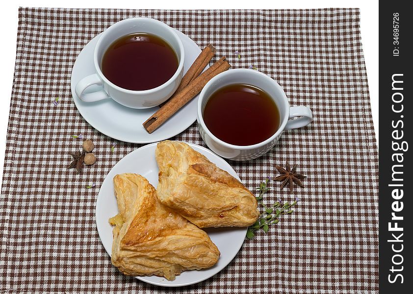 Two cups of tea and Delicious sweet pineapple puffs
