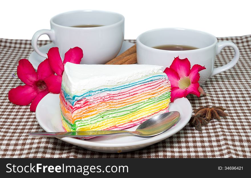 Morning cups of tea with the piece of delicious rainbow Cake