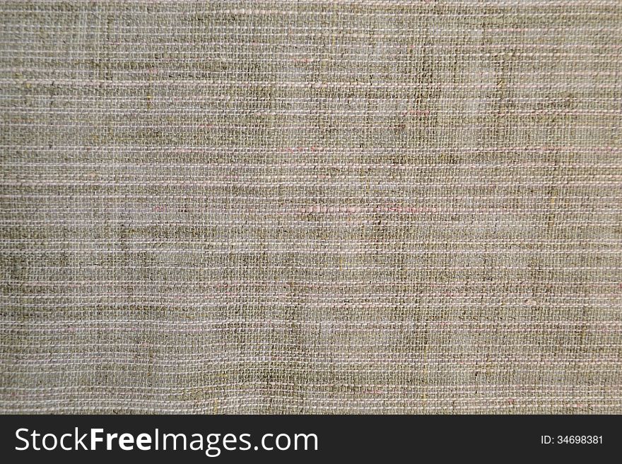 Piece of gray fabric with a coarse weave. Piece of gray fabric with a coarse weave