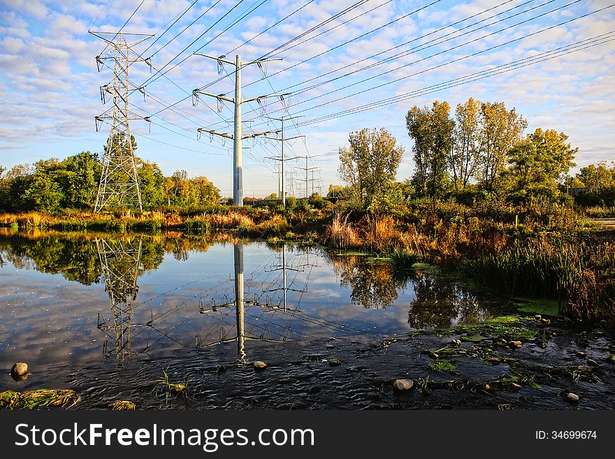 High-voltage towers sky background.