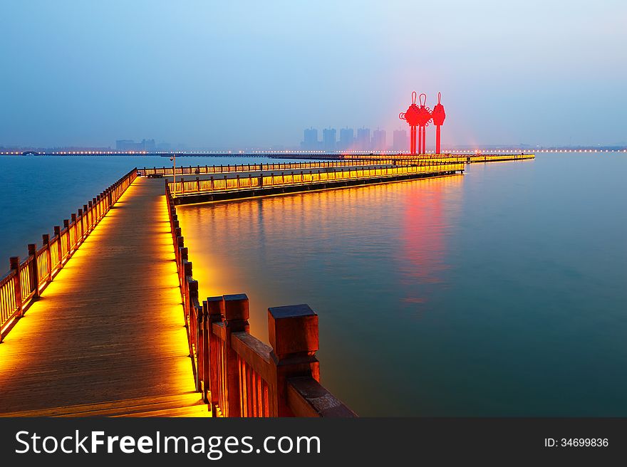 Golden brown wooden trestle and chinese knot