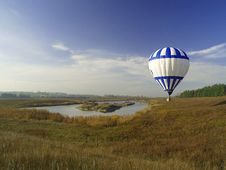 Hot Air Balloon Over Pond Stock Photography