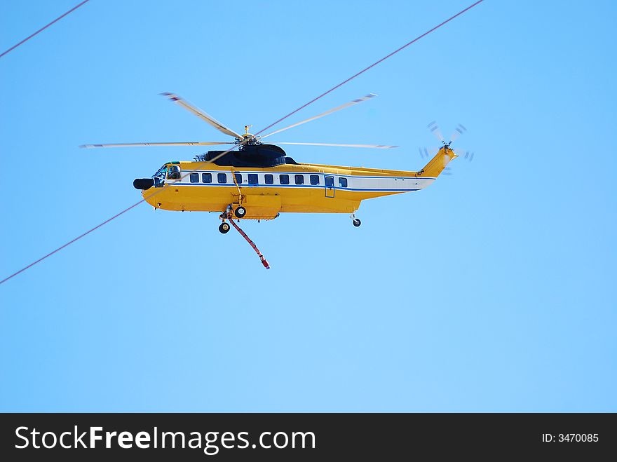 Helicopter and fire hose in Firefight in north Los Angeles County; Castaic Lake, California. Helicopter and fire hose in Firefight in north Los Angeles County; Castaic Lake, California