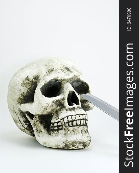 Skull With A Knife Blade