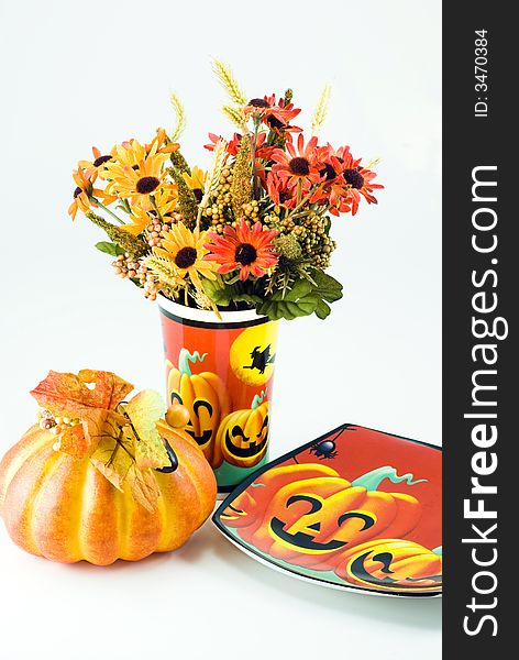 Hallowwen Flowers with a pumpkin and hallowween style plate